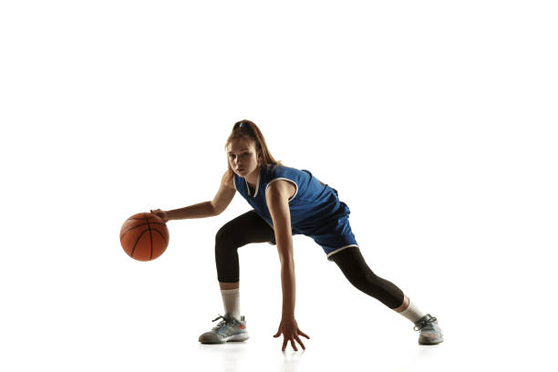 istock Young caucasian female basketball player against white studio background 1190820059