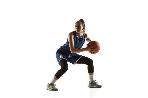 istock Young caucasian female basketball player against white studio background 1190820067