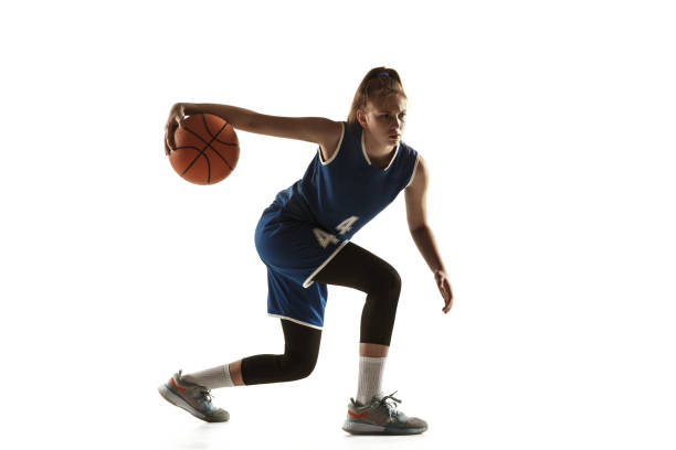 istock Young caucasian female basketball player against white studio background 1190820071