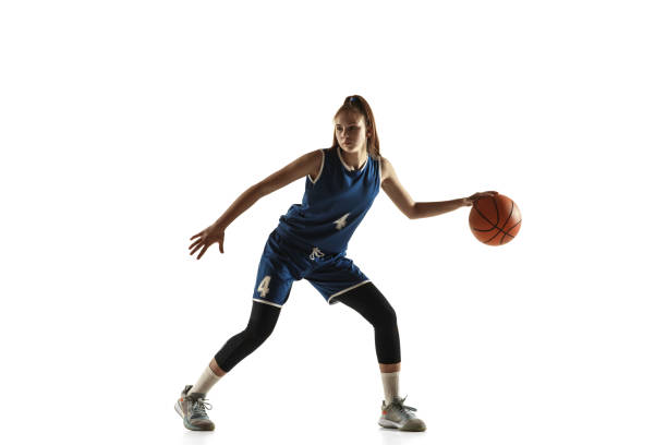 istock Young caucasian female basketball player against white studio background 1190820076