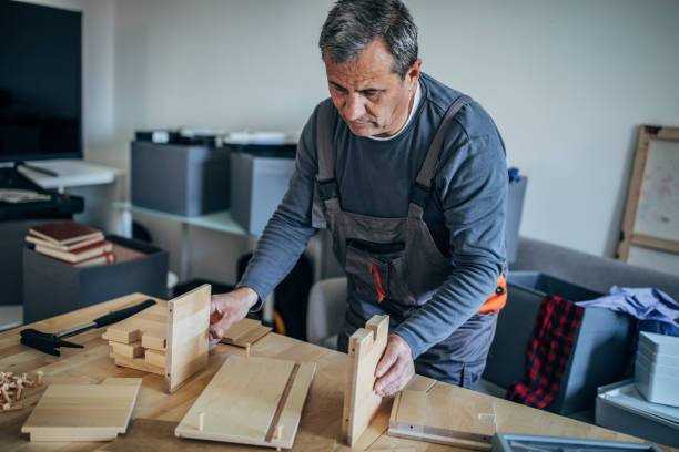 istock Senior carpenter is working with wood 1190820174