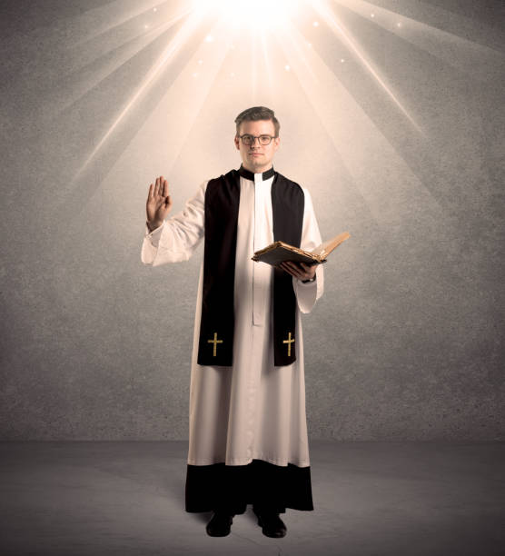istock young priest in giving his blessing 1190822508
