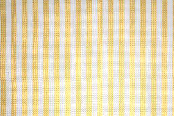 istock Tablecloth fabric with yellow and white lines (degraded light bulb). Home fabric. 1190822576
