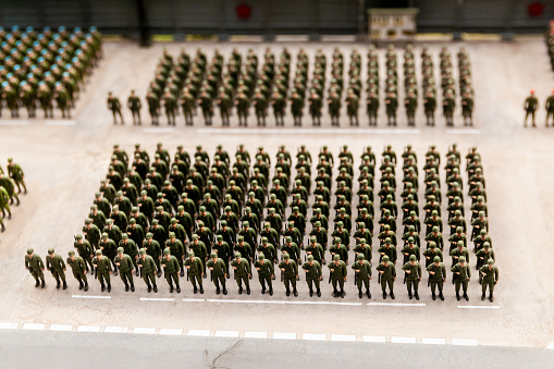 composition of many toy soldiers. construction of soldiers on the ground