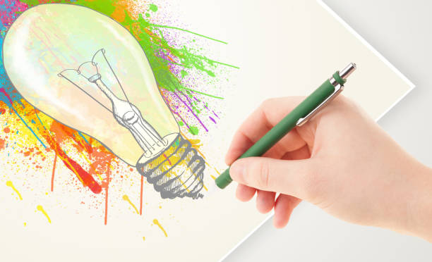 istock Hand drawing colorful idea light bulb with a pen 1190824051