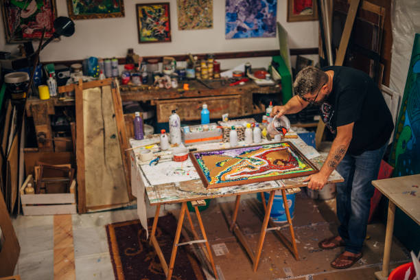 istock Male artist creating art 1190826288