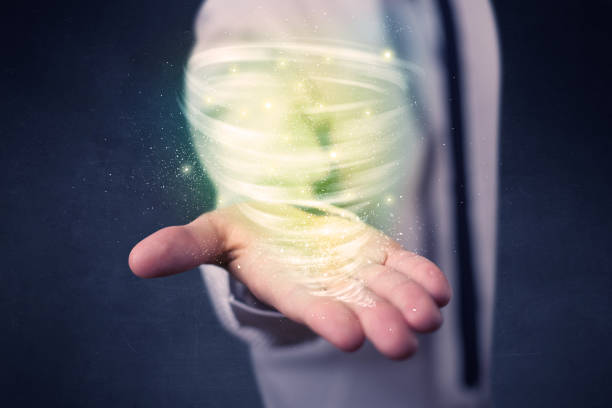istock Businessman holding green tornado 1190827491
