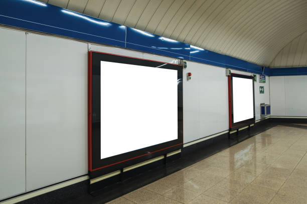 istock Two blank billboards inside a subway station corridor 1190827510