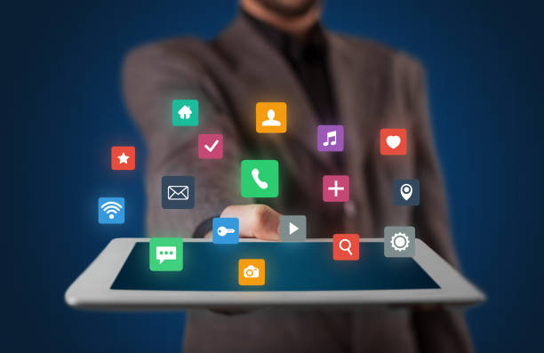 istock Businessman holding tablet with multimedia concept 1190827711