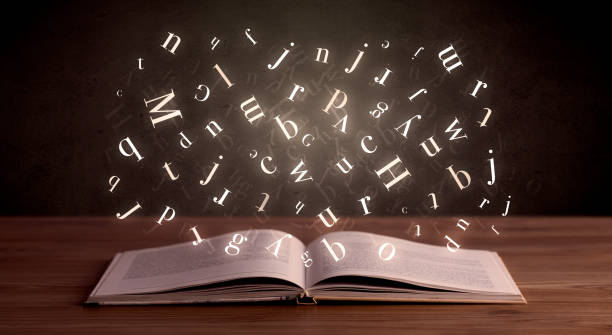 istock Alphabet letters over the book 1190827846