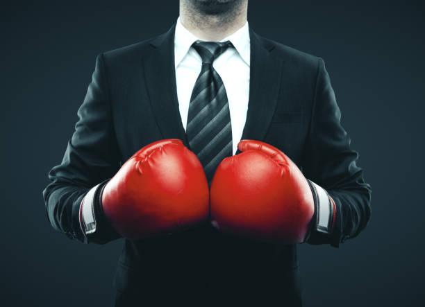 istock Businessman in red boxing gloves 1190829256
