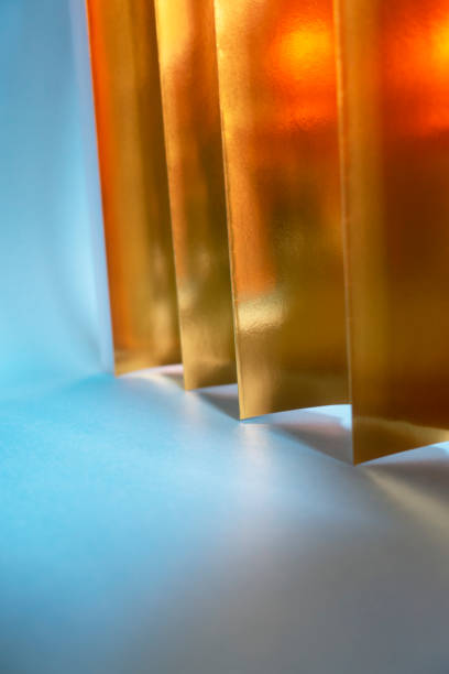 istock Blue and gold paper background with diagonal lines 1190830424