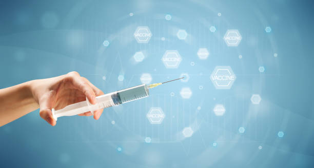 istock Female doctor holding syringe 1190830578