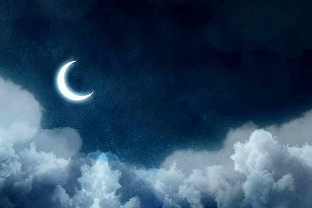 istock Night picture with bright moon above clouds at starry sky. 1190833372