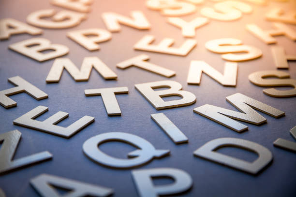 Mixed solid letters pile closeup photo. Education background concept