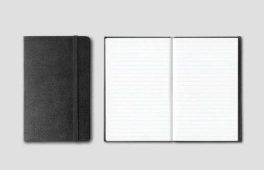 Black closed and open notebooks isolated on grey