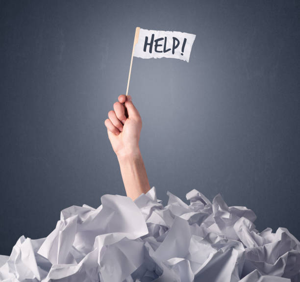 istock Female hand holding help sign 1190837220