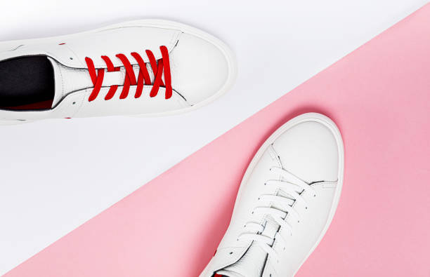 istock White sneakers isolated on colorful background 1190837289