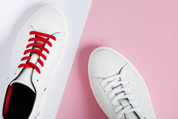 istock White sneakers isolated on colorful background 1190837303