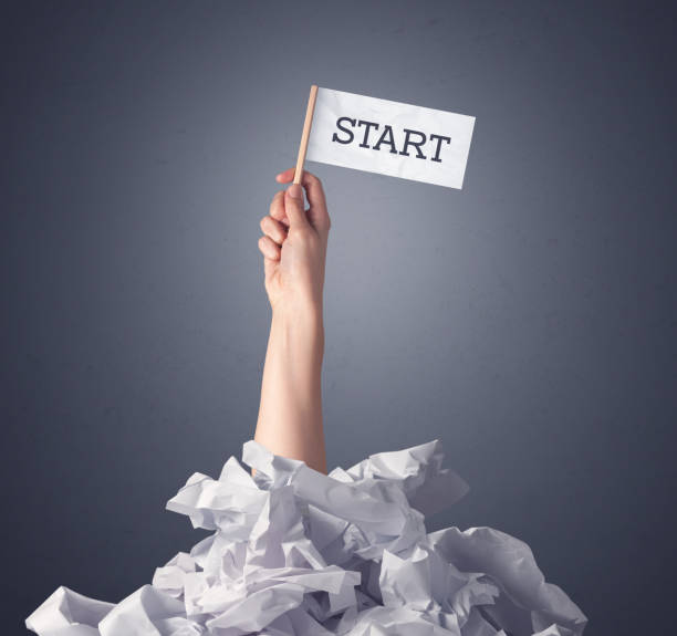 istock Female hand holding start sign 1190837351