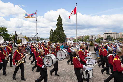 Victoria, BC, Canada -May 22, 2019: Battle of Marching Bands - North -  from Canada and USA in the Victoria Day in front of Parliament House. This is Victoria's largest parade, attracting well over 100,000 people..