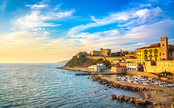 Marina of Piombino sunset view from piazza bovio.Tuscany Italy Marina of Piombino sunset view from piazza bovio. Maremma Tuscany Italy Europe. rubber rocks stock pictures, royalty-free photos & images