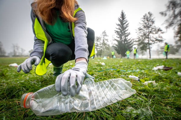 istock Female volunteer collecting rubbish 1190841114