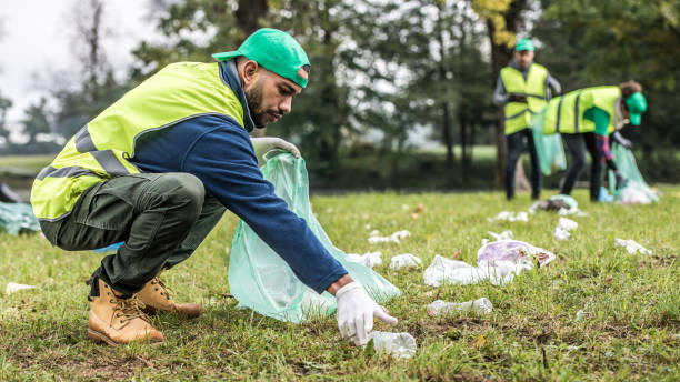 istock Volunteers collecting rubbish in park 1190841124