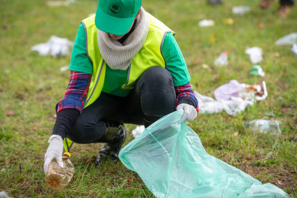 istock Female volunteer collecting rubbish 1190841145