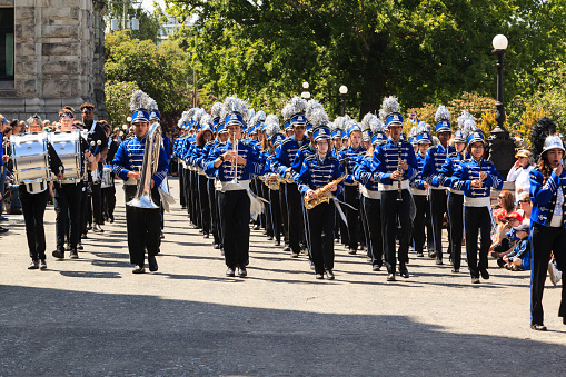 Victoria, BC, Canada - May 22, 2019: Battle of Marching Bands - OHS -  from Canada and USA in the Victoria Day in front of Parliament House. This is Victoria's largest parade, attracting well over 100,000 people..