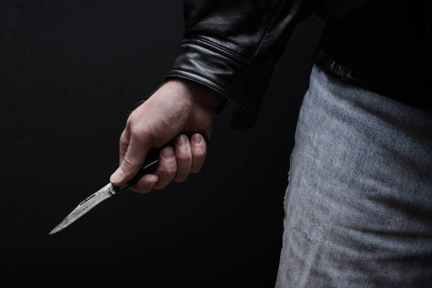 Man Brandishing Knife Man brandishing knife in a threatening manner. knife crime photos stock pictures, royalty-free photos & images