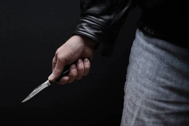 Photo of Man Brandishing Knife