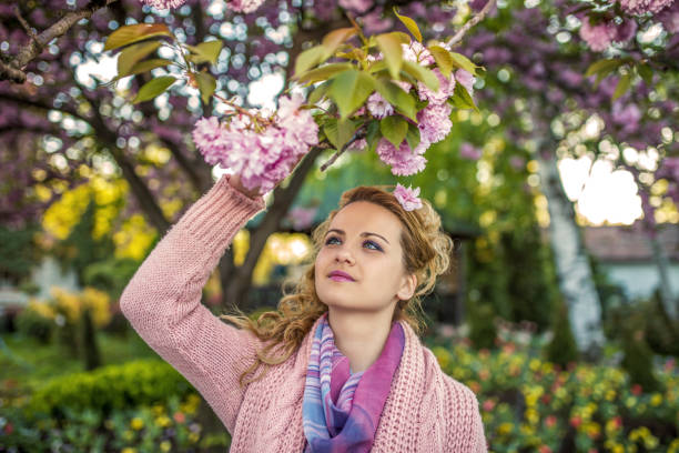 Woman enjoying in the backyard in spring
