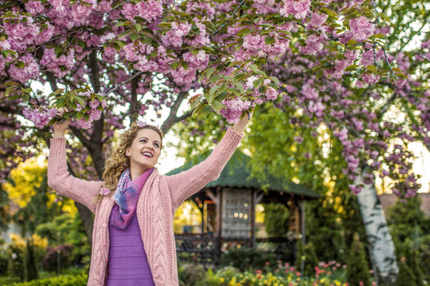 Woman enjoying in the backyard in spring