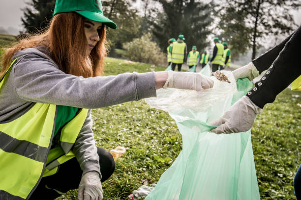 istock Women collecting rubbish in park 1190841799