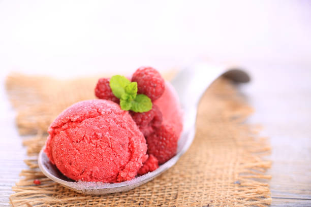 istock raspberry ice cream on wooden background 1190843977