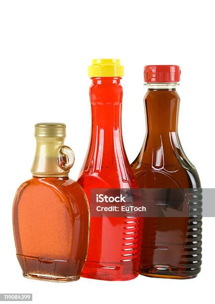 Syrup In Three Bottles Stock Photo - Download Image Now - Bottle, Brown, Close-up