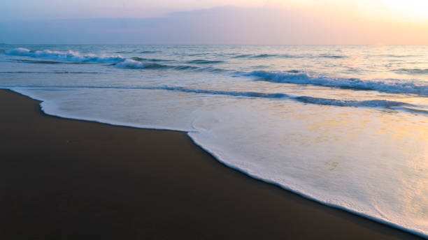 istock Morning ocean waves on the sandy beach 1190844076