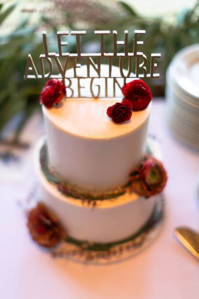 istock Beautiful White Wedding Cake with Floral Arrangement 1190853460