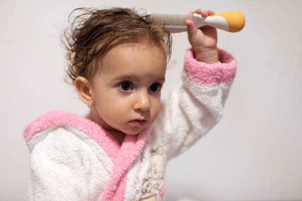 istock Confused Toddler Learning New Skills 1190854360