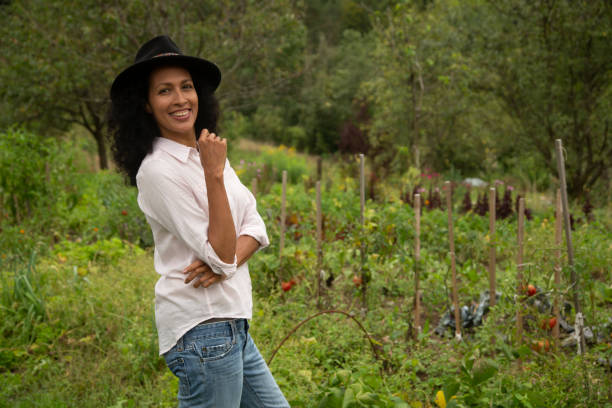 istock Young woman standing in farm 1190855095