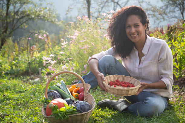 Young female farm worker sitting in farm