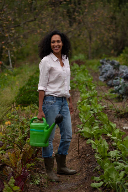 istock Young woman working in farm 1190855173