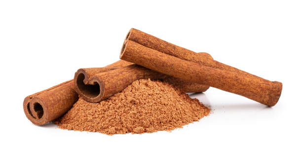 istock Cinnamon sticks and powder isolated on white background 1190855581