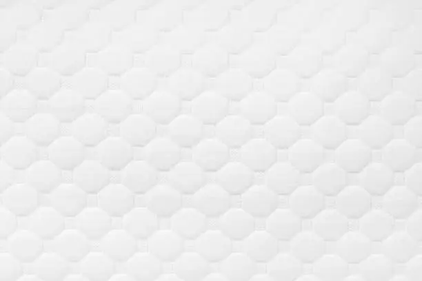 Photo of comfortable quilted white pillow
