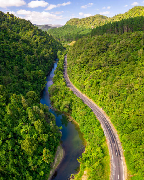 istock Idyllic winding country road and river 1190856860