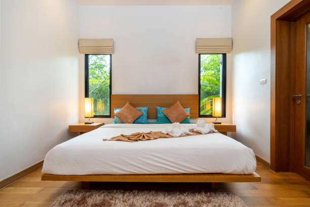 istock Modern and spacious bedroom in luxury home 1190861347