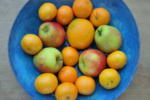istock Oranges and Apples in a blue ceramic bowl 1190861557