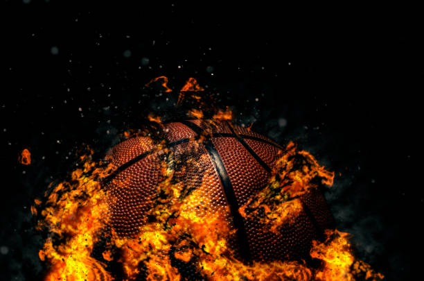 istock Basketball ball on black background with fire 1190861603