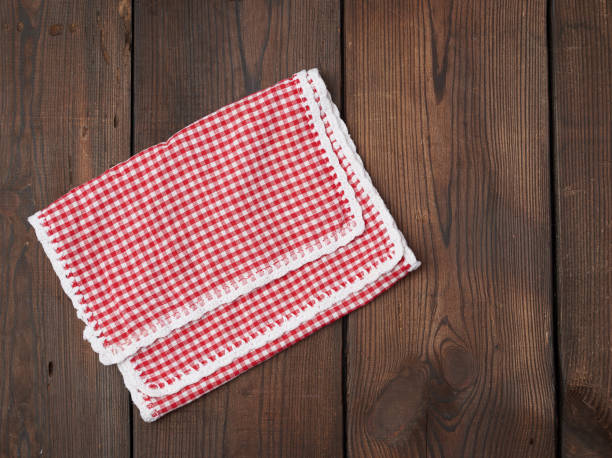 istock white red checkered kitchen towel on a brown wooden background 1190862567